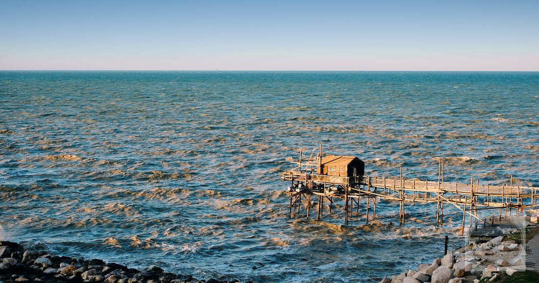 A tranquil view of a traditional trabocco fishing hut on the Adriatic Sea in Vasto, Abruzzo, Italy.