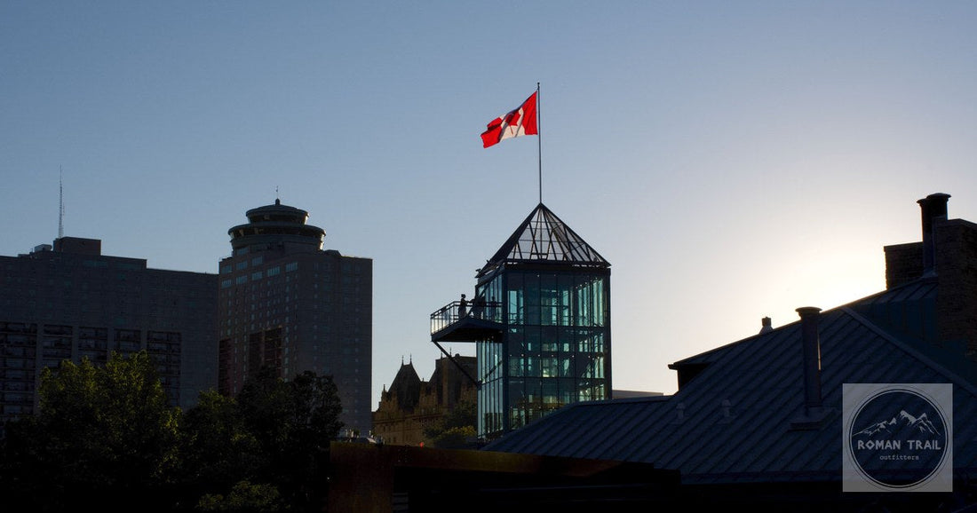 The Winnipeg skyline at sunset with a Canadian flag, Manitoba