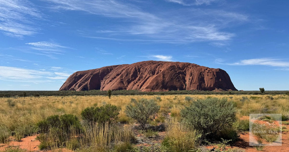 Uluru and the surrounding desert under a bright blue sky, Northern Territory