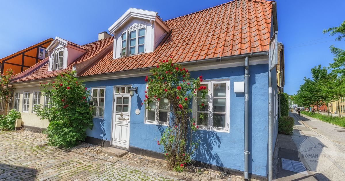 A colourful traditional house on a cobbled street in Arhus, Denmark