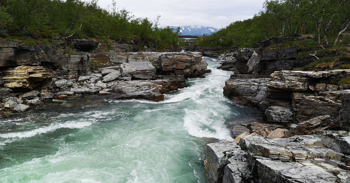 Rapids running through rocky terrain in Abisko National Park, Sweden