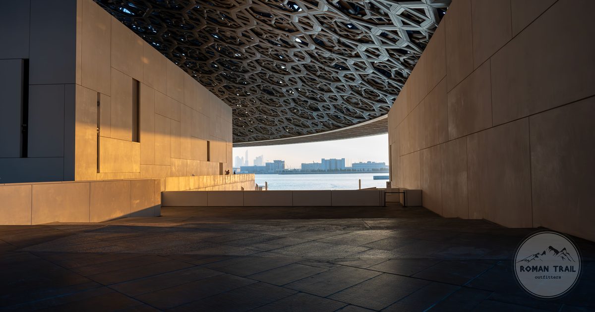 The geometric dome of Louvre Abu Dhabi at golden hour, UAE