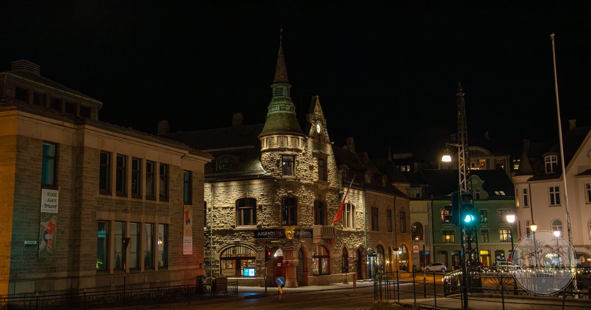 Art Nouveau architecture lit at night in Alesund, Norway