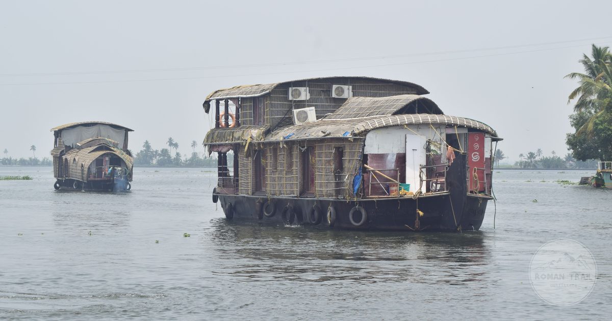 Traditional houseboats moored on the Alappuzha backwaters in Kerala, Alleppey packing list for women by Roman Trail Outfitters