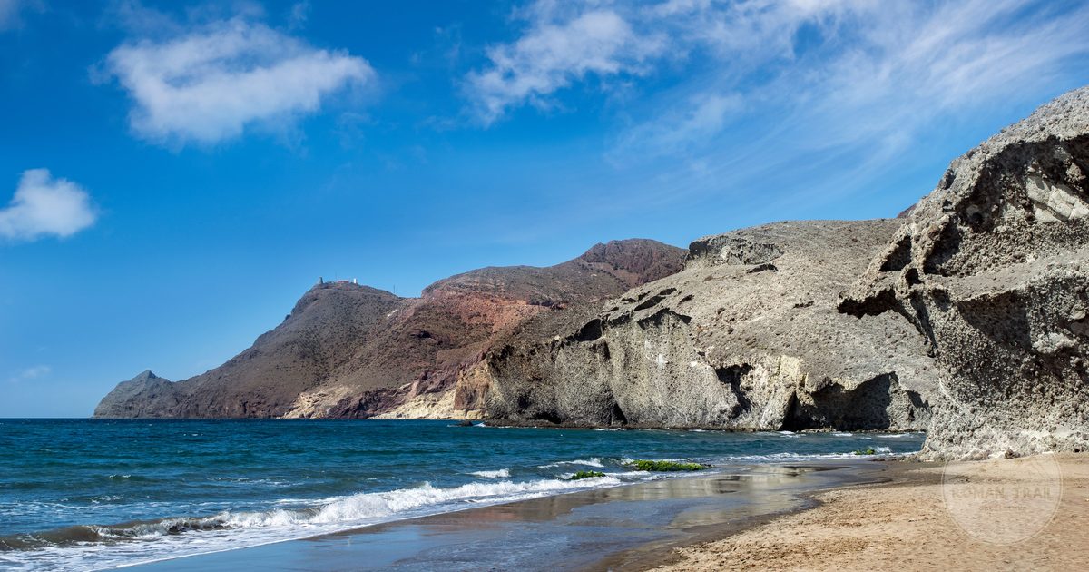 Rugged cliffs and a quiet beach at Cabo de Gata, Almeria, Spain