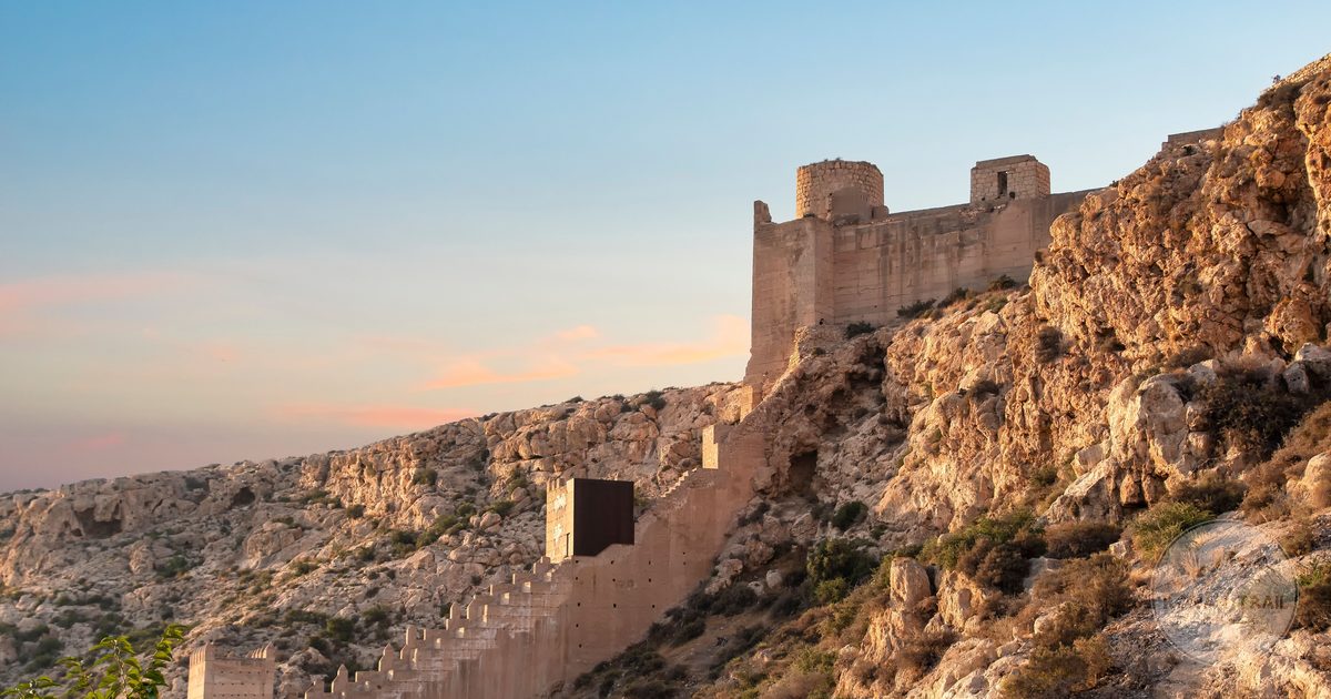 The Alcazaba fortress on the cliff at sunset in Almeria, Spain