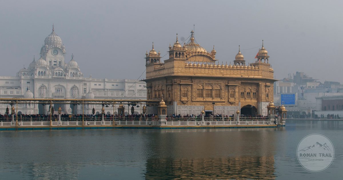 The gilded sanctum of the Golden Temple mirrored in still water, Amritsar packing list for women by Roman Trail Outfitters