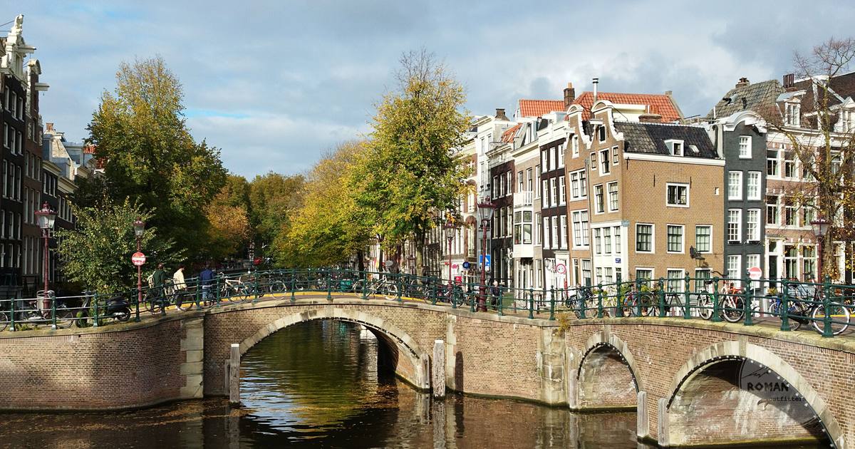An Amsterdam canal bridge with autumn foliage, Netherlands