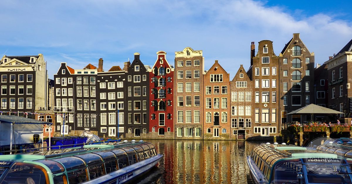 Historic canal houses and boats in Amsterdam, Netherlands