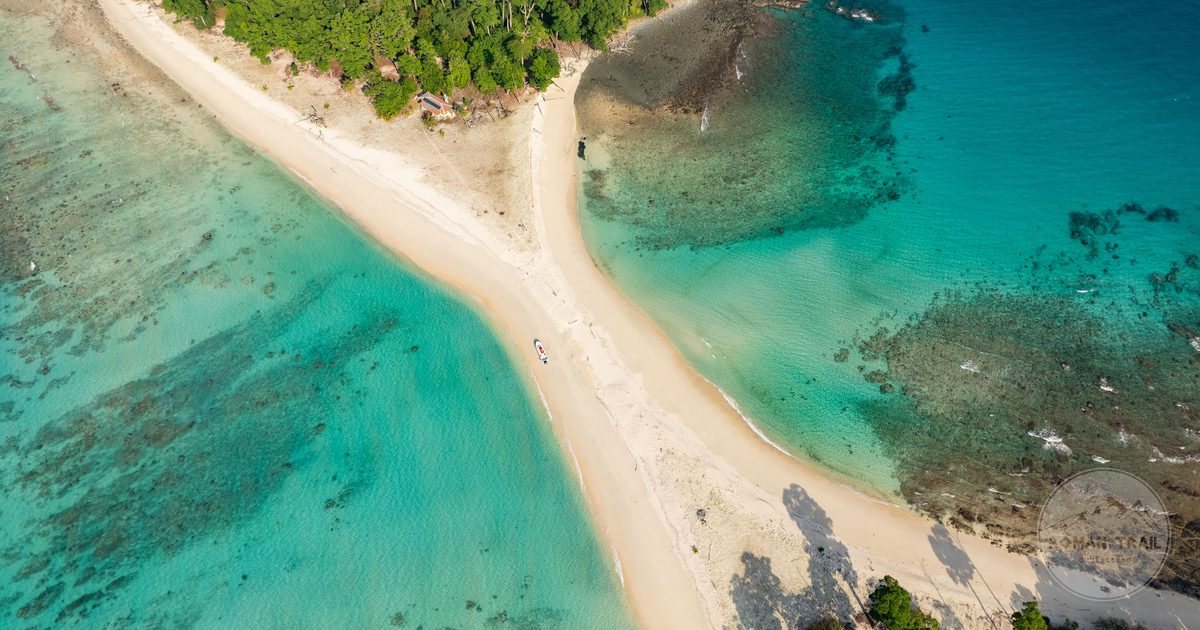 Aerial view of turquoise water and forest at Cinque Island, Andaman Islands, India