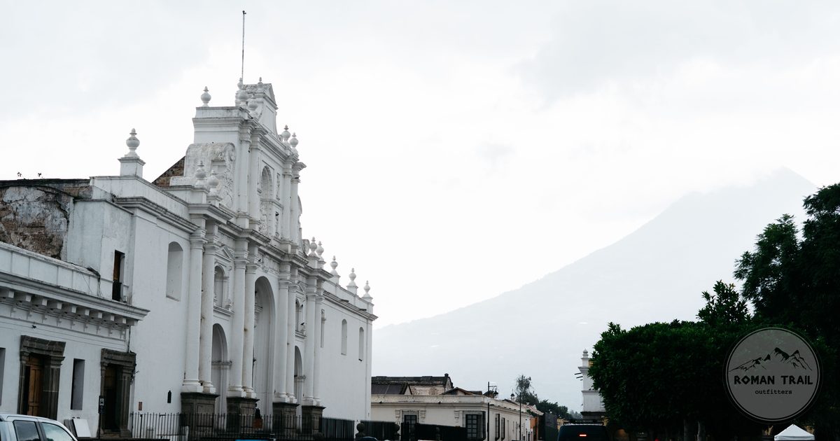 A colonial church in Antigua Guatemala with Volcan de Agua behind it