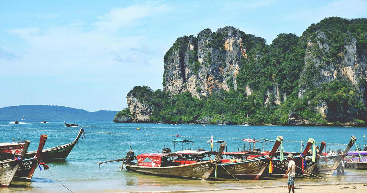 Long tail boats on the sand at Ao Nang Beach, Krabi, Thailand