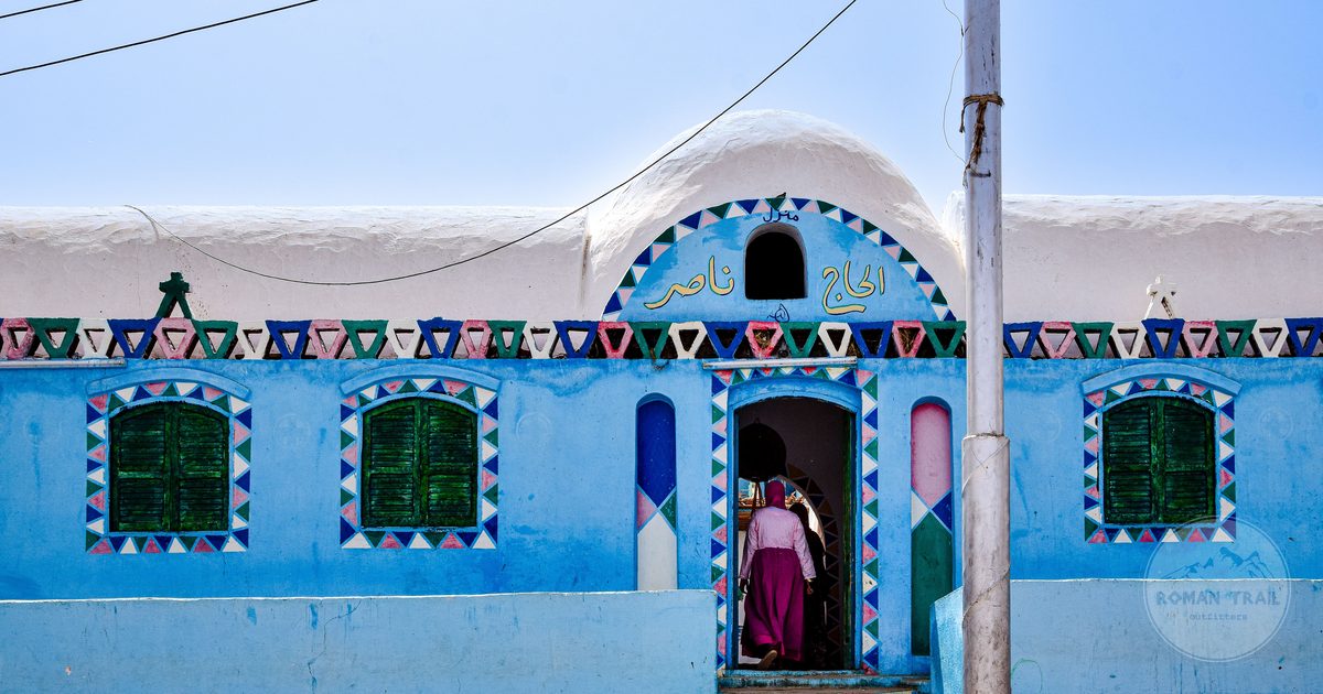 A blue house painted with geometric patterns in a Nubian village at Aswan, Egypt