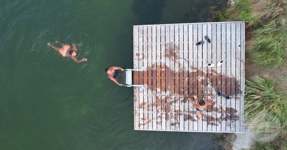 Swimmers at a dock in a spring fed swimming hole near Austin, Austin for women travelers