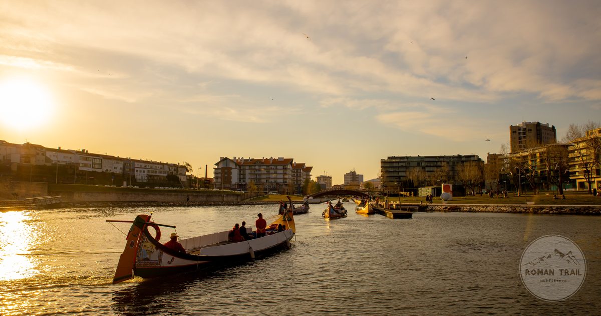 Sunset over the Aveiro lagoon with traditional boats, Portugal