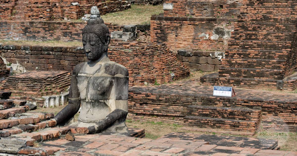 A Buddha statue among the ruins of Wat Mahathat at Ayutthaya, Thailand