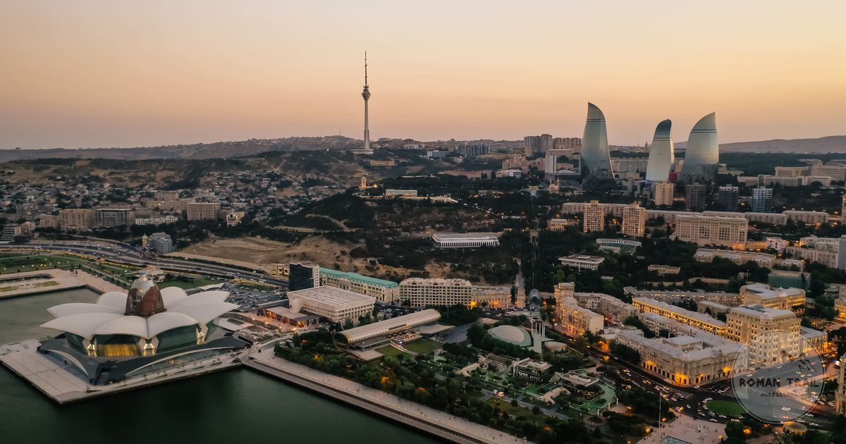 Baku skyline with the Flame Towers above the Caspian Sea at dusk, Baku travel guide for women by Roman Trail Outfitters