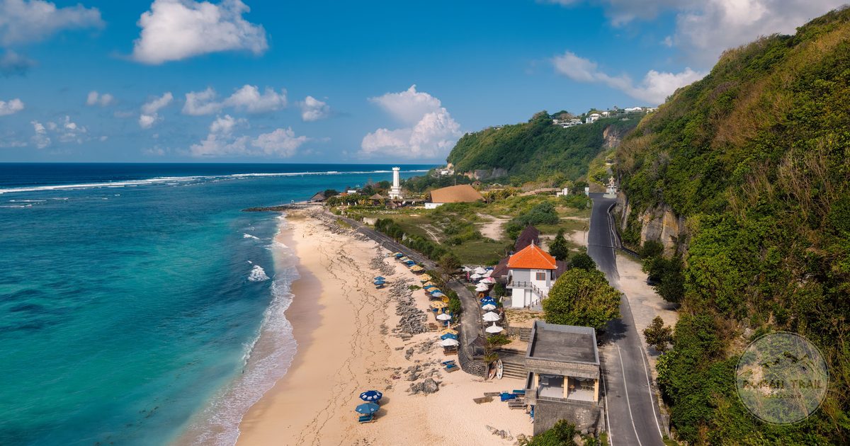 A Bali beach and lighthouse on the coastline, Indonesia