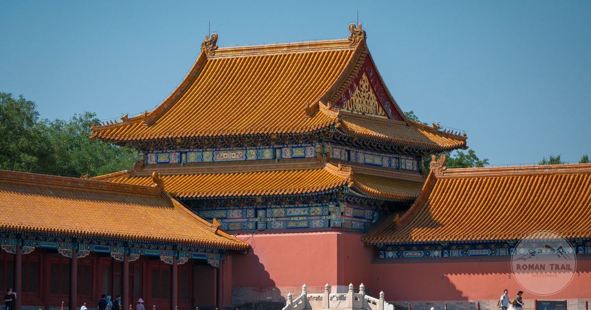 Traditional tiled roofs and red timber halls inside the Forbidden City in Beijing, Beijing packing list for women by Roman Trail Outfitters