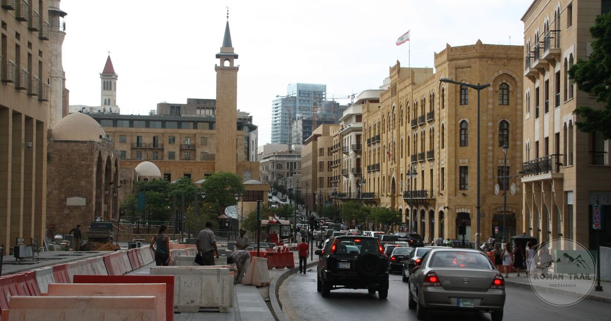 A busy street with historic architecture and traffic in downtown Beirut
