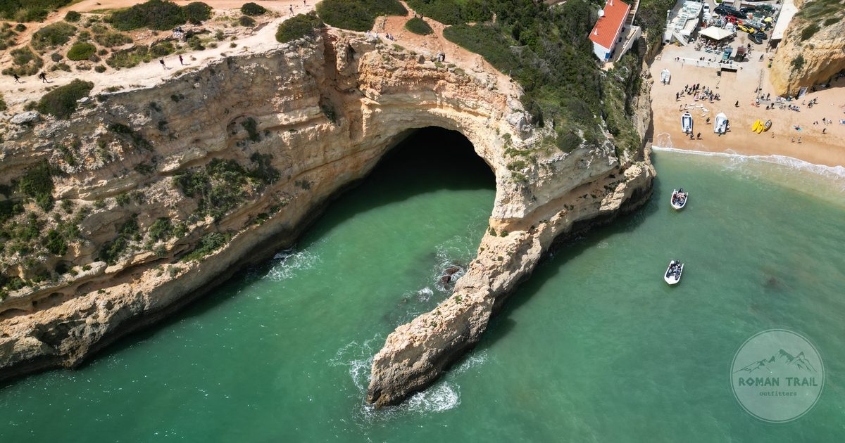 Aerial view of Benagil Cave and the surrounding cliffs, Algarve Portugal