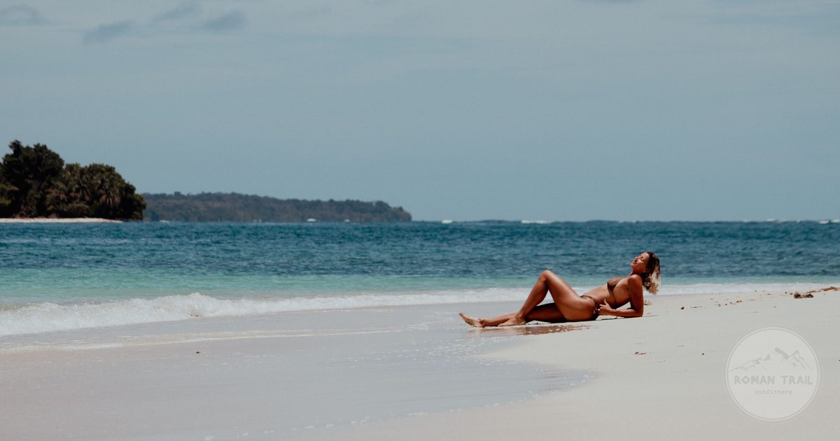 A woman on a quiet beach at Bocas del Toro, Panama