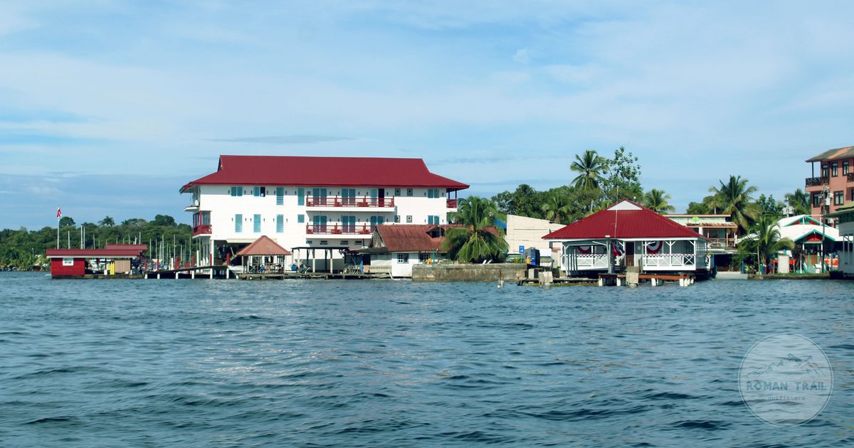 Red-roofed waterfront buildings and palms at Bocas del Toro, Panama