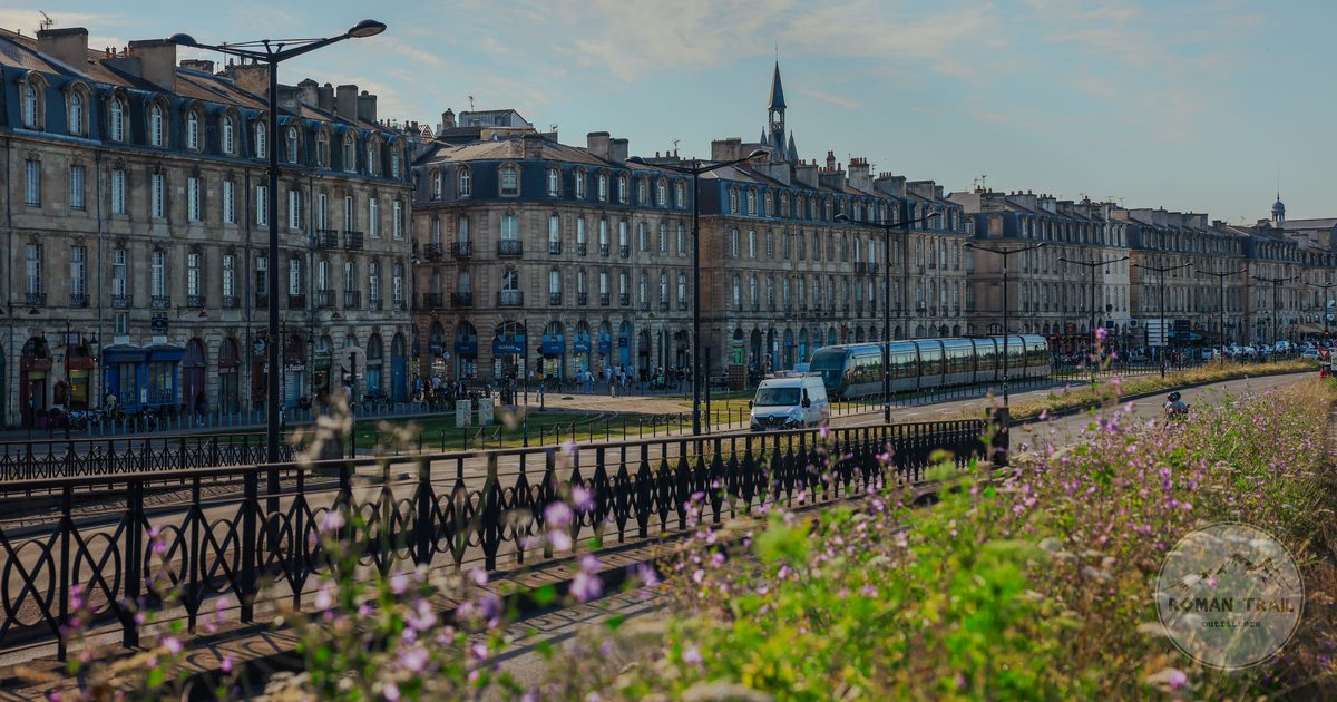 A tram passing historic buildings in Bordeaux, France