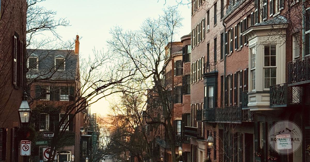 Historic Beacon Hill street of brick rowhouses at dusk, Boston for women travelers