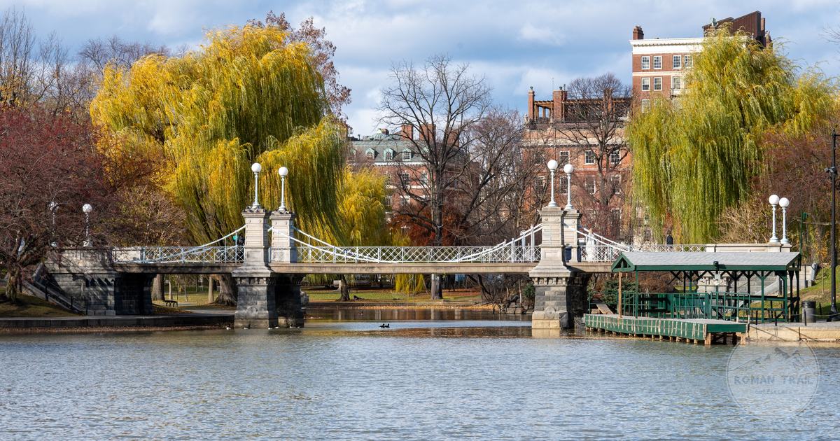 The lagoon bridge in Boston Public Garden framed by autumn willows, Boston for women travelers