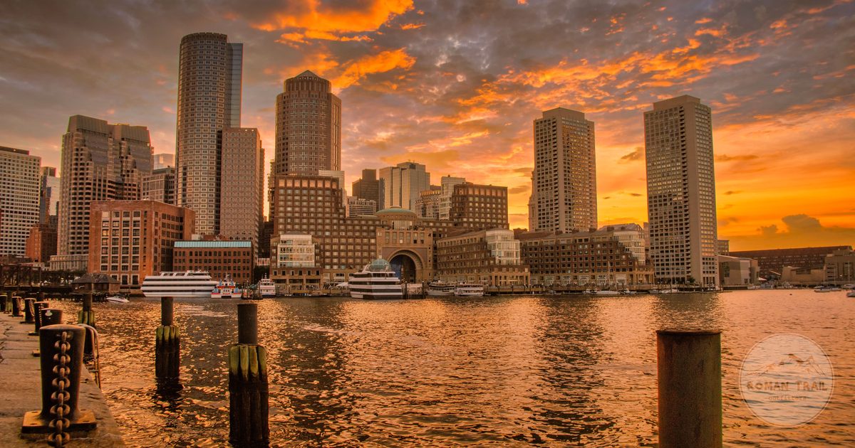 Boston Harbor and the downtown waterfront at sunset, Boston travel guide for women by Roman Trail Outfitters