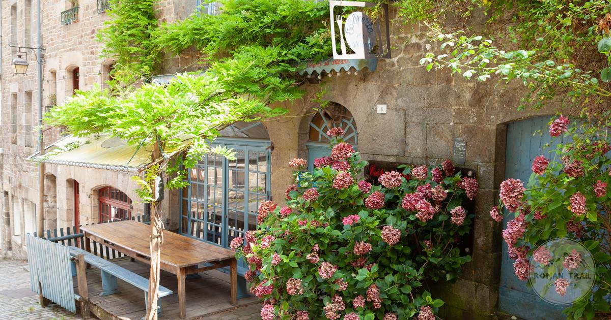 A medieval alley with hydrangeas at Dinan, Brittany, France