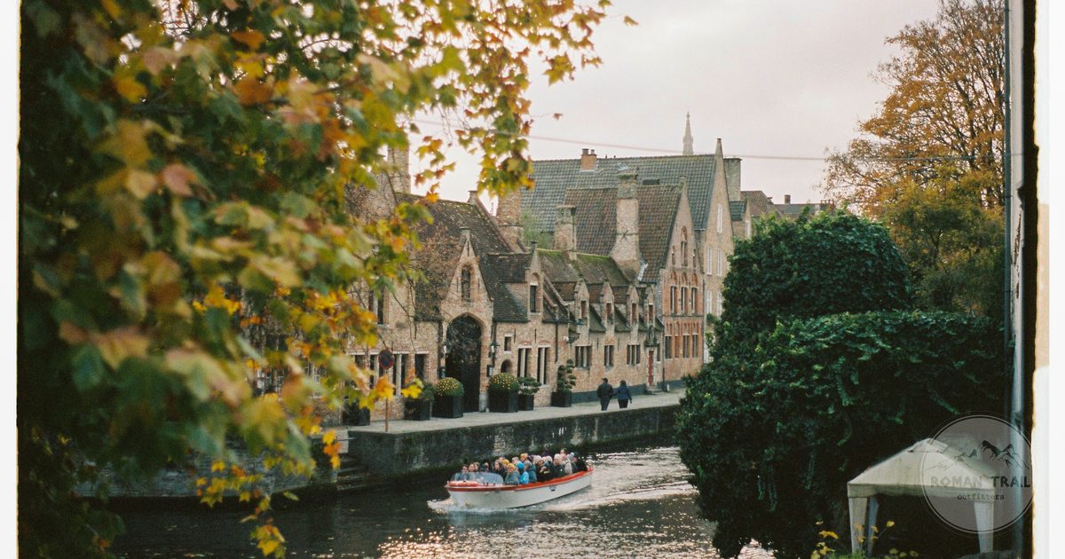 A boat tour on the canals of Bruges in autumn, Belgium