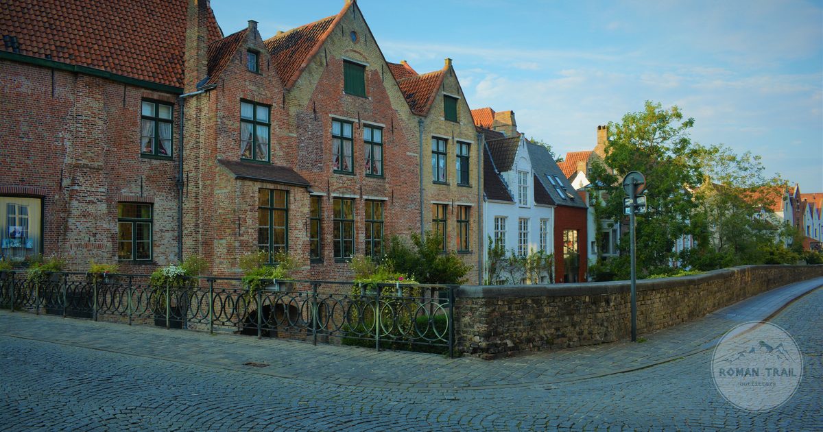 Medieval houses along a cobbled street in Bruges, Belgium