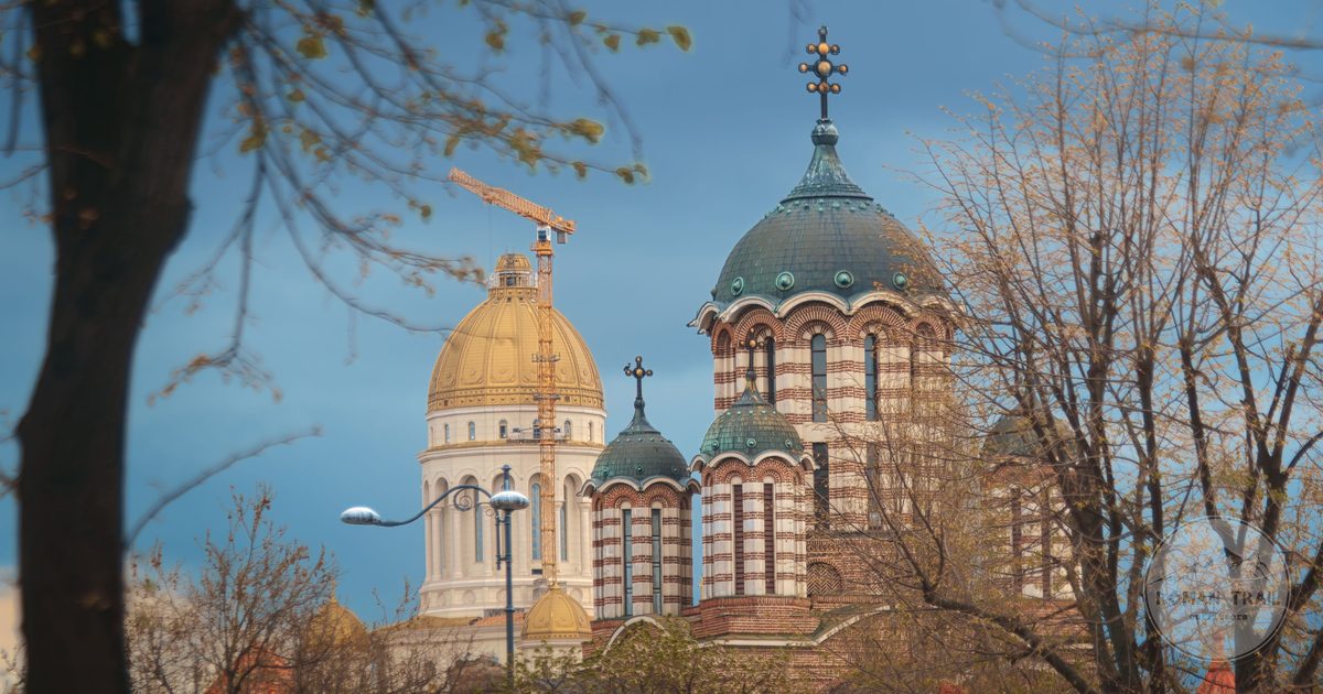 Church domes among trees in Bucharest, Romania