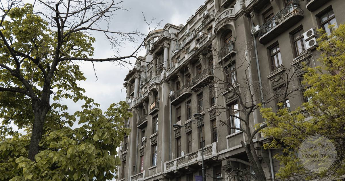A neoclassical building with balconies and columns in Bucharest, Romania