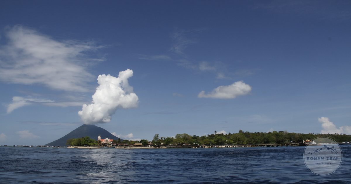 Manado Tua volcano and the coast under a clear sky, North Sulawesi, Indonesia