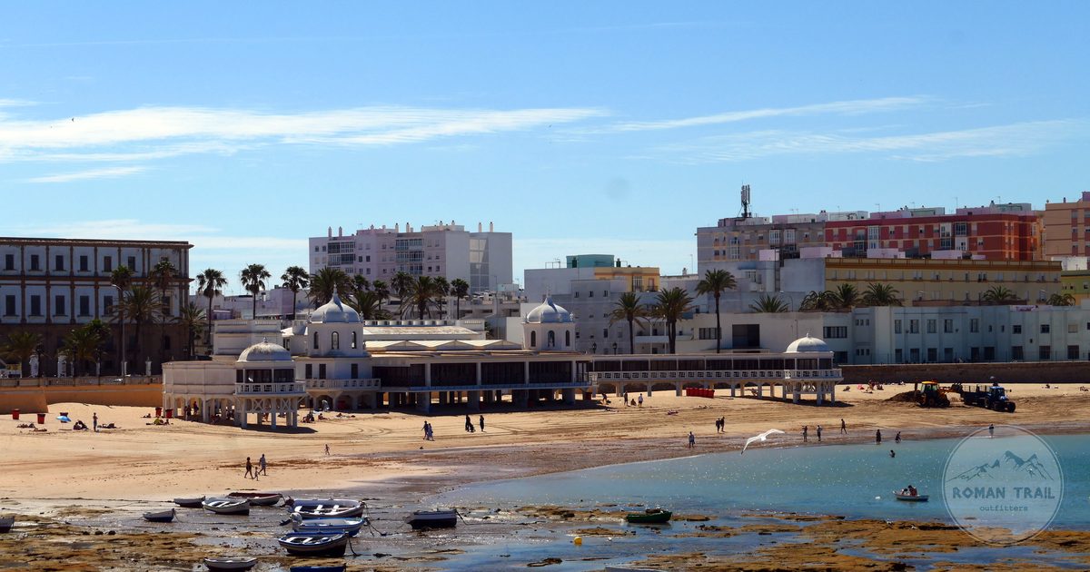La Caleta beach and its historic bathhouse in Cadiz, Cadiz packing list for women by Roman Trail Outfitters