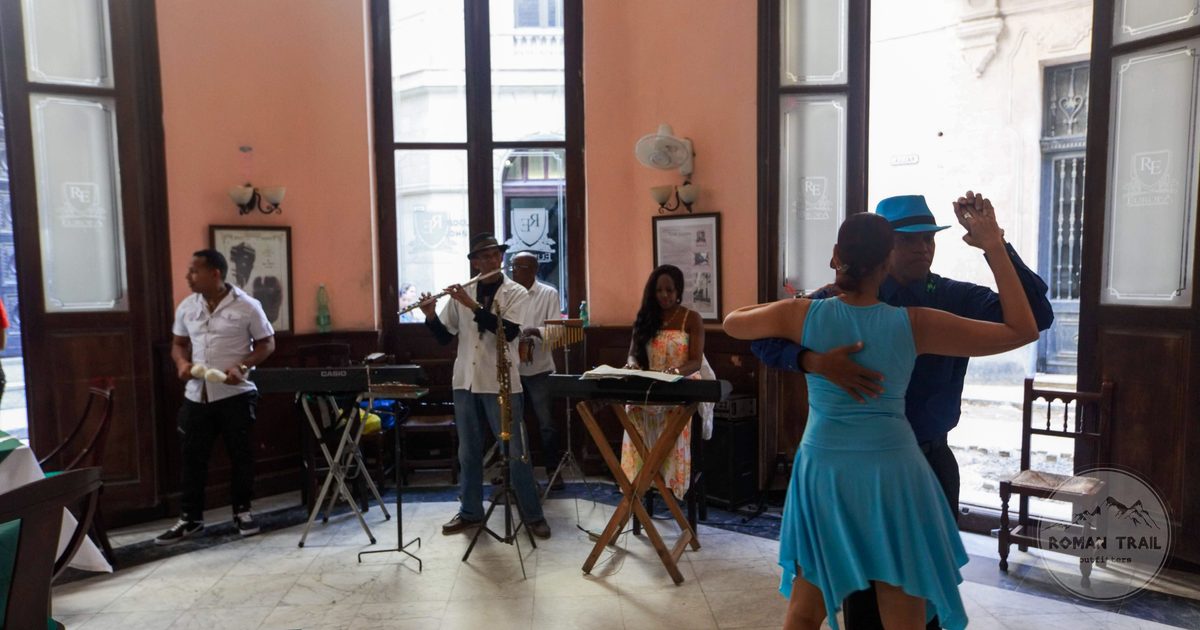 Salsa dancers and live musicians performing indoors, Colombia