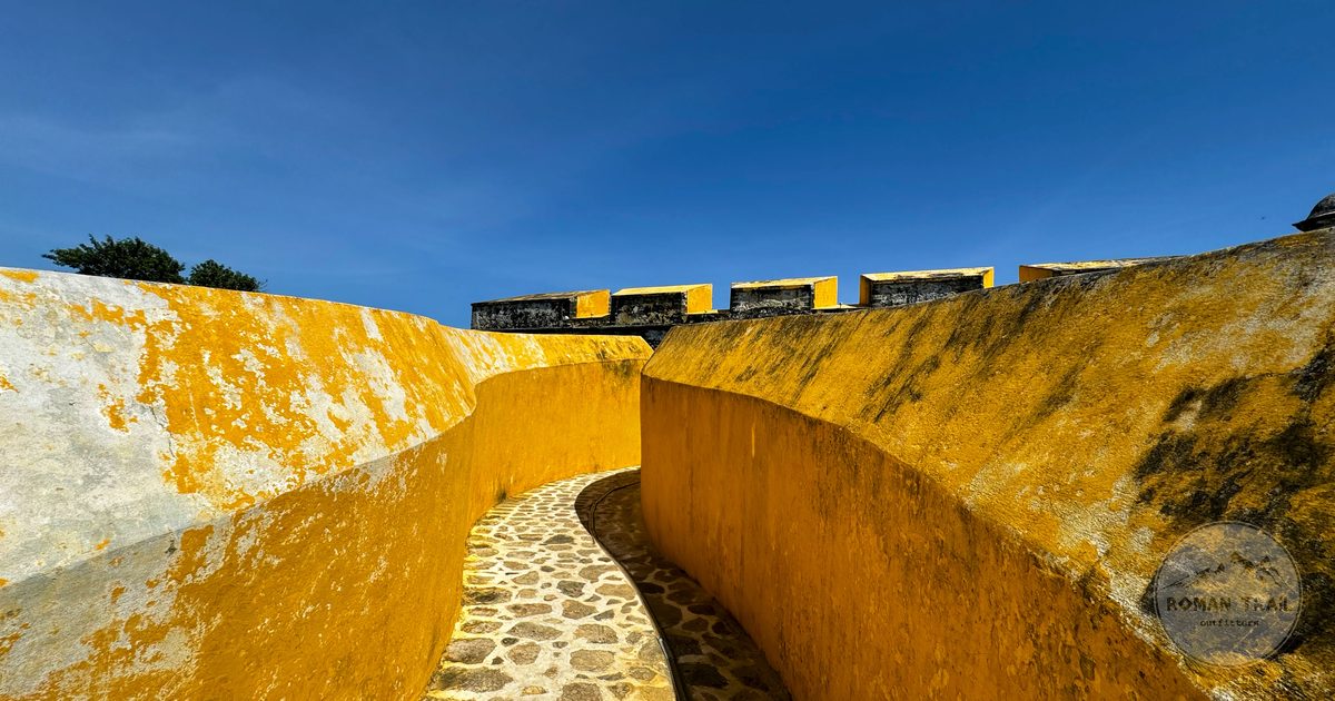 The yellow walls of the fort walkway at San Francisco de Campeche, Mexico