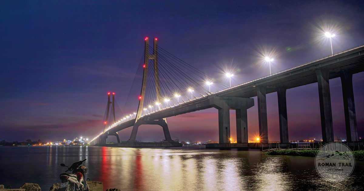 The Can Tho bridge lit at night above the river, Vietnam