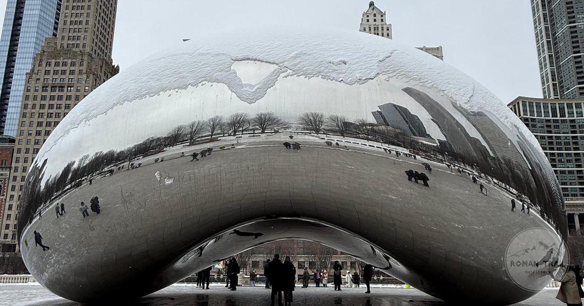 Cloud Gate sculpture reflecting the Chicago skyline on a snowy winter day in Millennium Park, Chicago for women travelers