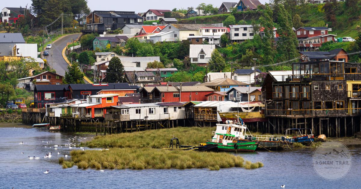 Stilt houses and boats on the shoreline at Castro, Chiloé Island, Chile