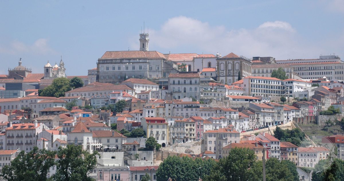 Red rooftops and historic architecture across Coimbra, Coimbra packing list for women by Roman Trail Outfitters