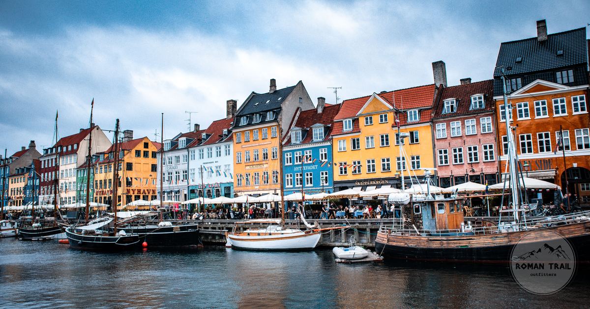 Boats and colourful buildings at Nyhavn harbour, Copenhagen, Denmark