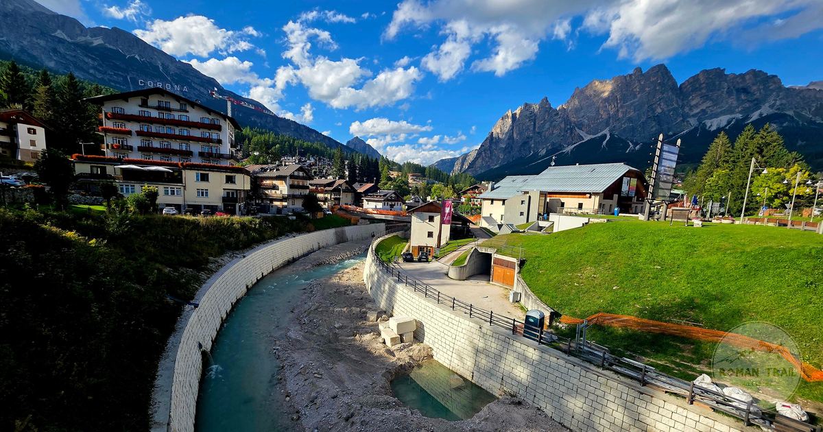 A river and mountain view under clear skies at Cortina d'Ampezzo, Italy