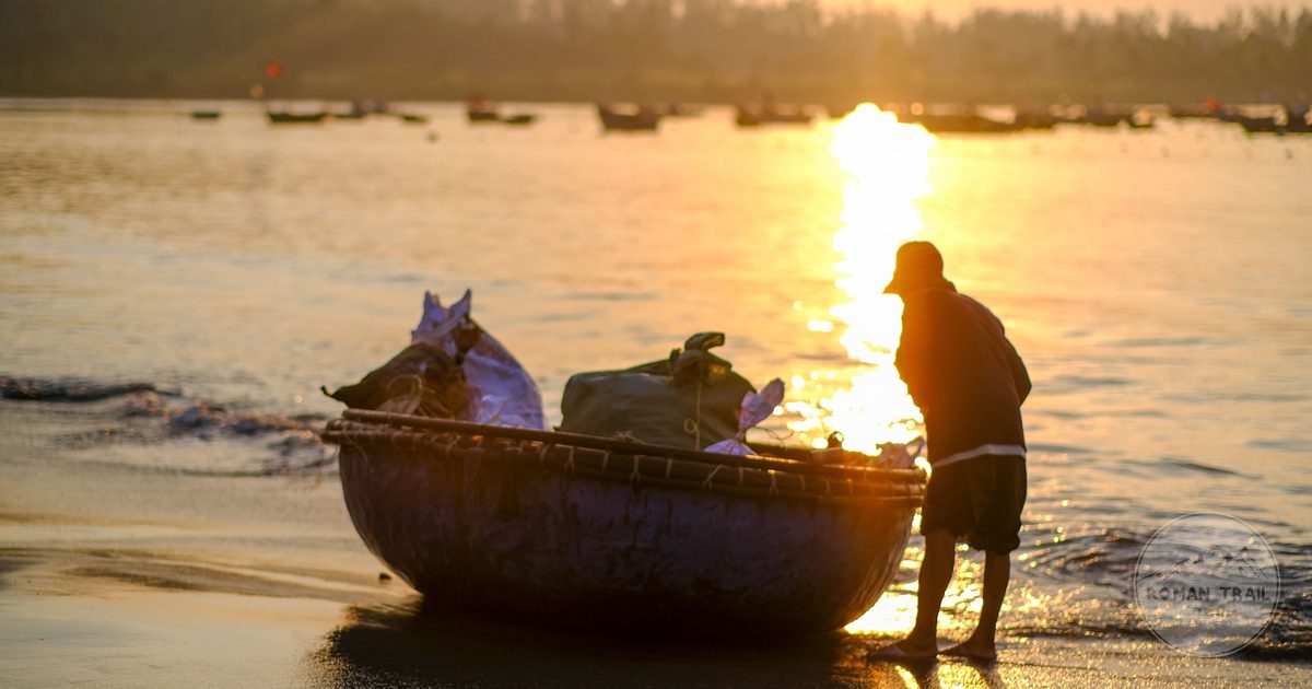A fisherman on My Khe Beach at sunrise, Da Nang, Vietnam