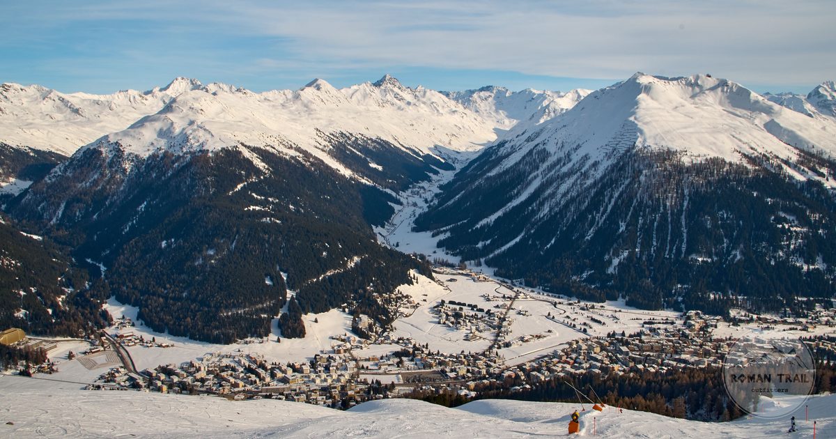 Skiers on the slopes above Davos in winter, Switzerland
