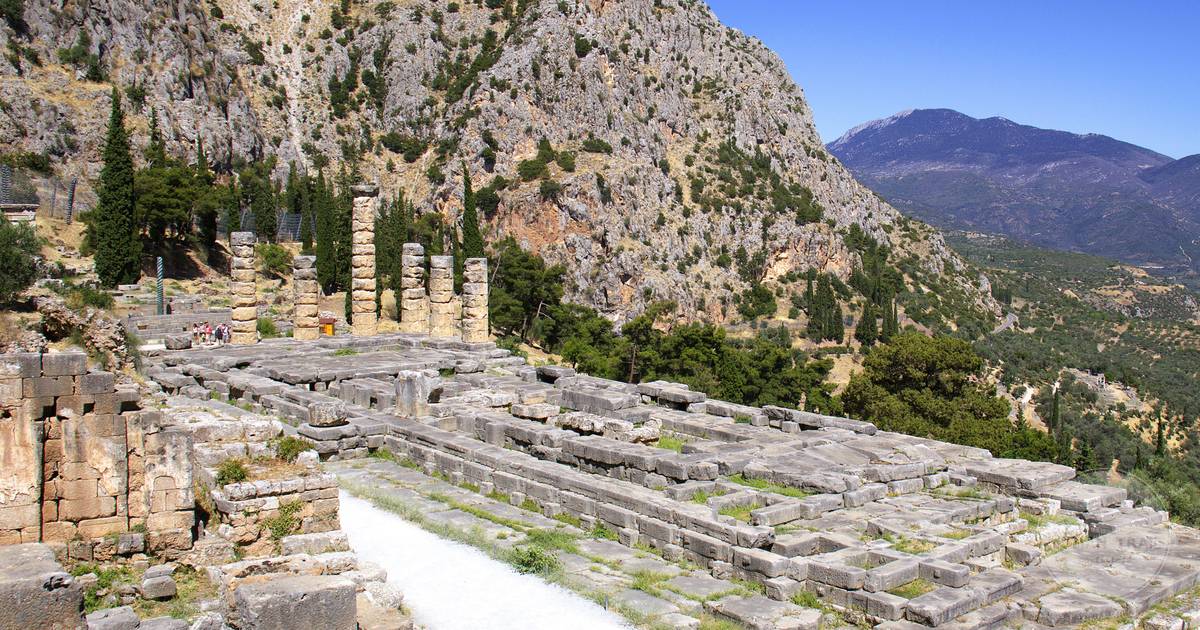 The columns of the Temple of Apollo on the mountainside at Delphi, Delphi packing list for women by Roman Trail Outfitters