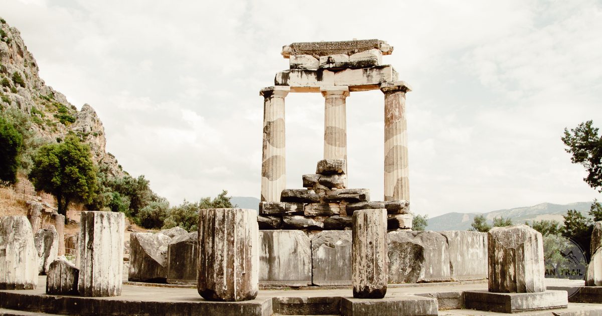 The circular Tholos at the sanctuary of Athena Pronaia in Delphi, Delphi packing list for women by Roman Trail Outfitters